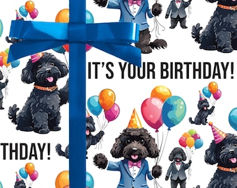 May include: White wrapping paper featuring a repeating pattern of black cartoon dogs with balloons, party hats, and suits. The text "IT'S YOUR BIRTHDAY!" is displayed in black. A blue ribbon and bow are in the foreground.