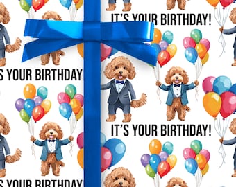 May include: White wrapping paper with a blue ribbon. The paper has a repeating pattern of brown dogs wearing blue suits and holding colourful balloons. The text "It's your birthday!" is repeated on the paper.