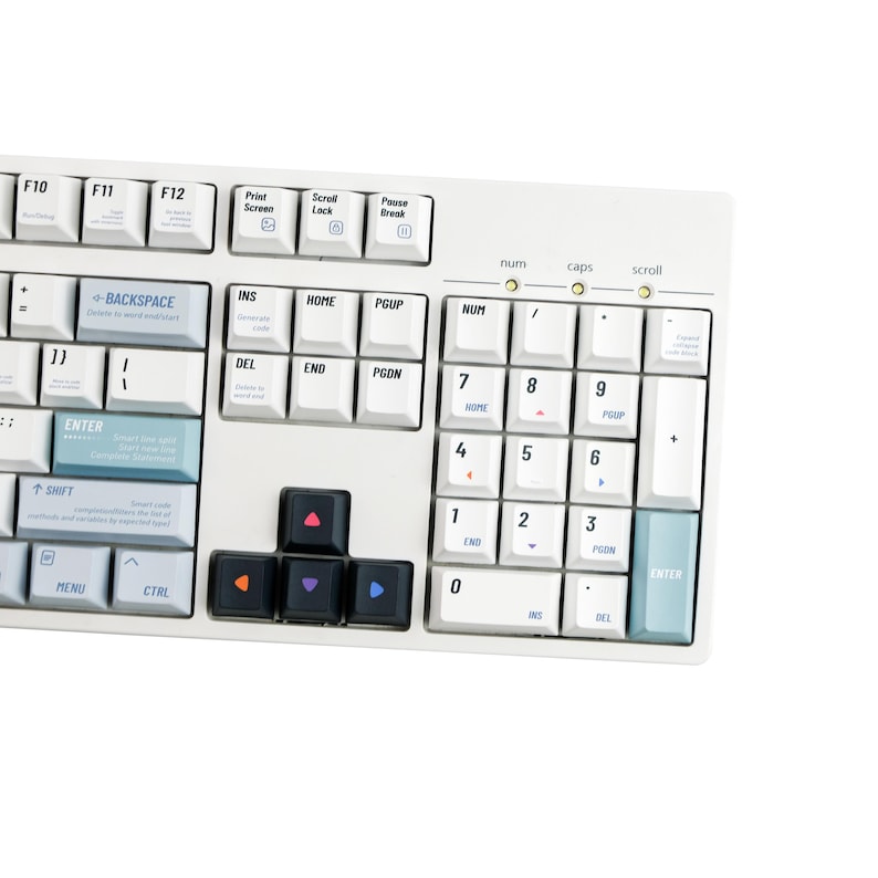 May include: A white mechanical keyboard with various keycaps. The keyboard features a standard layout with function keys, a number pad, and arrow keys. The keycaps are a mix of white, black, and colorful accent keys.
