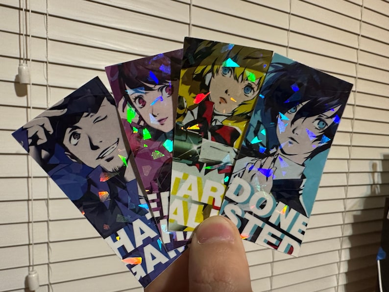 May include: Four holographic cards featuring anime characters with text that reads "Hard Done Faster" and "Half-Gained".