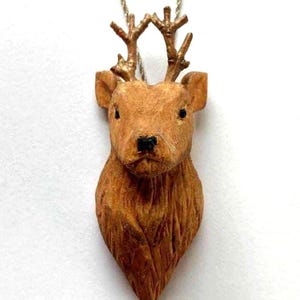 Hand-carved and whittled wooden deer head necklace. A perfect and unique handmade woodland jewellery gift for nature/ animal lovers