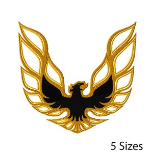 May include: Embroidered patch with a black bird emblem with outstretched wings, set against a gold-coloured, flame-like background. The text "5 Sizes" is displayed below the emblem, indicating available size options.