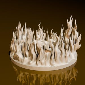 Peut inclure: Une sculpture en céramique blanche de flammes sur une base ronde. La sculpture est sur un fond brun.