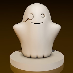Puede incluir: Una figurita de fantasma blanca con un solo ojo y un pequeño parche negro. El fantasma sonríe y tiene una forma redondeada. La figurita está sentada sobre una base blanca.