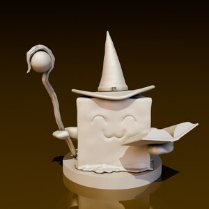 May include: A white ceramic figurine of a square-shaped character wearing a pointed hat and holding a staff and a book. The character has a smiling face and is standing on a round base.