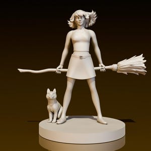 Puede incluir: Una figurita blanca de una mujer sosteniendo una escoba con un gato sentado a su lado. La mujer lleva una falda y una blusa. La figurita está sobre una base blanca.