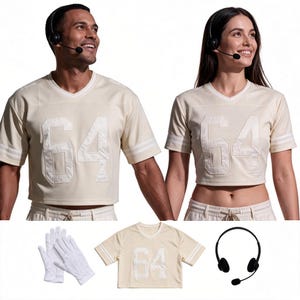 May include: A cream-colored short-sleeved jersey featuring the number 64 in large white lettering on the front, a V-neckline, and white striped detailing on the sleeves. The set includes a pair of white gloves and a black headset with a microphone.