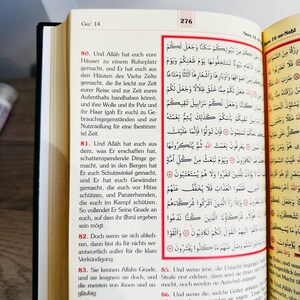 May include: Open book with Arabic text on the right page and German text on the left. The book is open to pages 276 and 14, with the title "Sura 16 an-Nahl" visible.