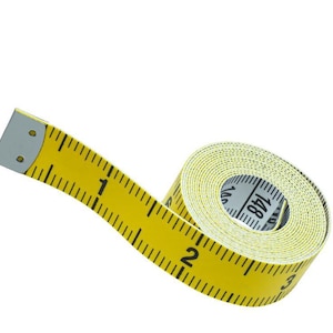 May include: A yellow measuring tape with black markings and numbers, unrolled to show the first few inches. The tape is made of a flexible material and is used for measuring length. The tape is marked with both inches and centimeters.