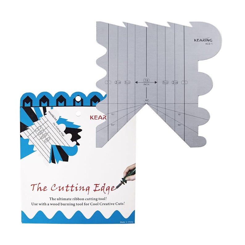 May include: A silver metal ribbon cutting tool with measurements in inches, and a white and blue package with the text "The Cutting Edge". The tool is designed for use with a wood burning tool.