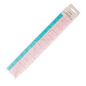 May include: A Kearing dual-color pattern grading ruler in its original packaging. The ruler is transparent with a teal side and a clear side featuring red grid lines and markings up to 12 inches. The packaging includes the text KEARING DUAL-COLOR PATTERN GRADING RULER 12 x 2 INCH.