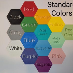 May include: A collection of hexagon-shaped color swatches in various shades, including red, orange, yellow, green, blue, and purple. The text "Standard Colors" is displayed above the swatches, with each swatch labeled with its respective color name.