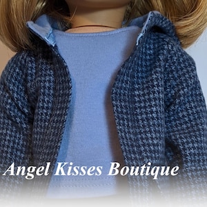 May include: A blue and grey patterned jacket with a light blue shirt underneath. The jacket has a hood and is made of a soft, comfortable fabric.  "Angel Kisses Boutique" is printed on the bottom of the image.