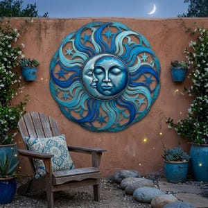 May include: A large, round, blue and turquoise metal wall art piece depicting a sun and moon with faces. The artwork is mounted on a reddish-brown wall, with a wooden chair and potted plants in the foreground.