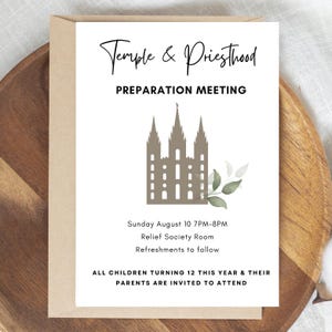 May include: A white invitation card with the text "Temple & Priesthood Preparation Meeting" and a graphic of a temple. The card includes event details and is set against a wooden background.