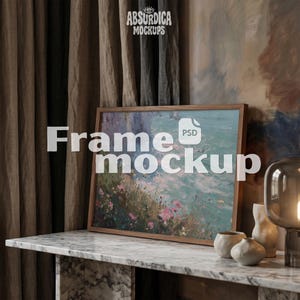 May include: A rectangular wooden frame containing an impressionistic painting of a floral landscape with blue and pink tones. The text "Absurdica Mockups" and "Frame mockup" are overlaid on the image, along with a small PSD file icon.