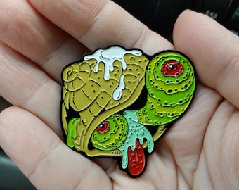 Madballs-inspired Parasitology enamel pin: Earlyworm the Zombie Snail ( Leucochloridium paradoxum )