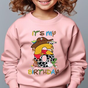Its My Birthday sweatshirt featuring a fun Woody inspired Toy Story design. Perfect for birthday celebrations this cowboy themed shirt is great for Disney fans and Toy Story lovers. Made from soft breathable fabric for all day comfort it is ideal for parties Disney trips or casual wear. Available in multiple sizes and colors with personalization options for a special touch. A great birthday gift for kids or adults who love the Toy Story movies.