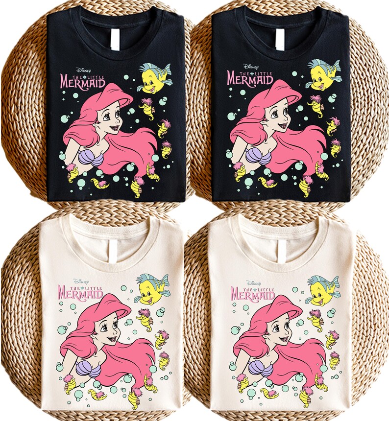 Retro vintage Ariel The Little Mermaid shirt featuring a nostalgic design with Ariel and Flounder. Made from soft, comfortable fabric for all-day wear. Perfect for Disney fans, princess lovers, and classic animation enthusiasts. Great for theme park visits, casual outfits, or as a unique gift. Available in multiple sizes and colors to match any style. A stylish and fun way to showcase love for this beloved Disney character.