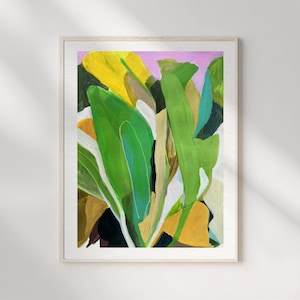 May include: A framed art print featuring an abstract painting of large, overlapping leaves in vibrant shades of green, yellow, and dark brown. The composition includes bold brushstrokes and a soft pink background, all encased in a light wood frame.