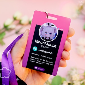 May include: A rectangular pink ID badge with a purple lanyard featuring a circular profile picture of an anime-style character, the name MoonMouse, pronouns She/Her, the text Helping Hands, Moon/Yuna, 21+, ASL Student, and a quote about the universe.