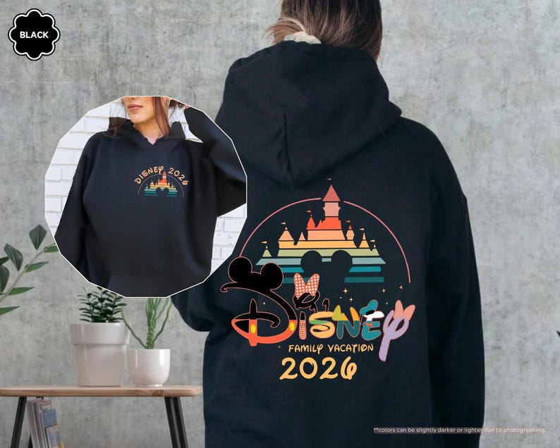 May include: Black hoodie with a colorful Disney castle design and the text "Disney Family Vacation 2026." The front of the hoodie features a smaller design with the text "Disney 2026." The design includes Mickey and Minnie Mouse.