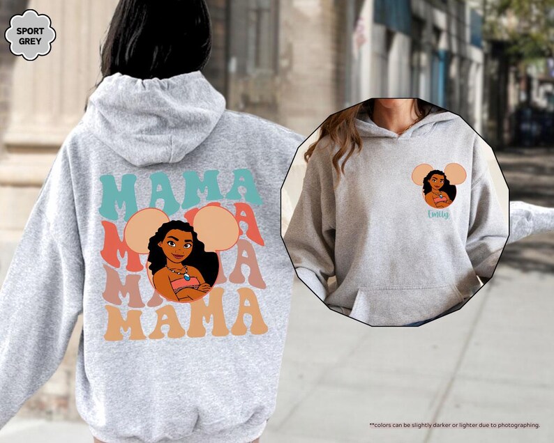 May include: A light gray hoodie with a graphic of a cartoon woman and the word "MAMA" in teal, coral, and orange. The design includes a cartoon image of a woman with the word "MAMA" repeated. The hoodie also has a small graphic on the front.