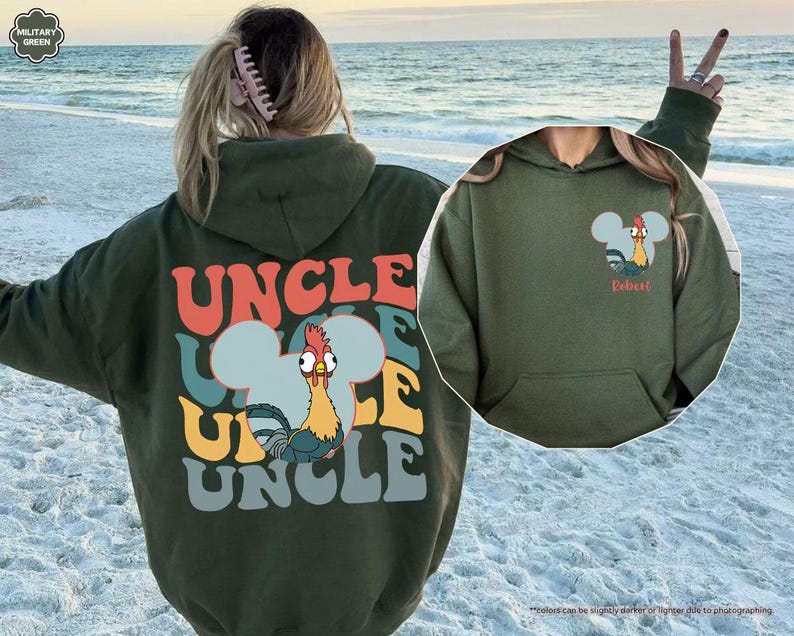 May include: A military green hoodie with the word "UNCLE" in colorful retro font on the back. A cartoon rooster is featured in a Mickey Mouse-shaped design. The front of the hoodie has a similar design with the word "Dobest".