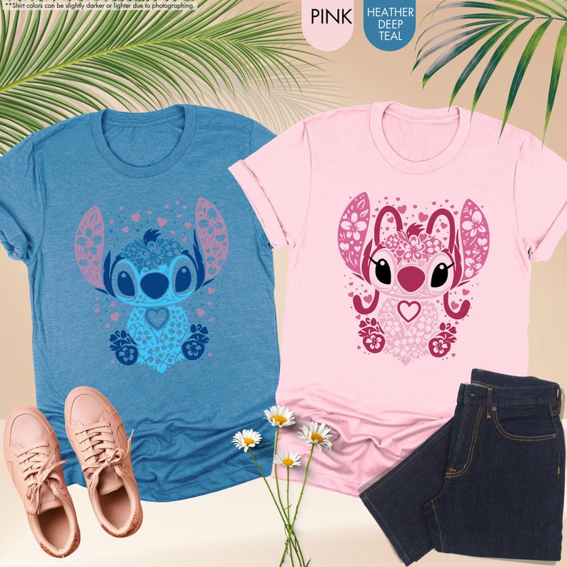 May include: Two short-sleeved t-shirts, one blue and one pink, each featuring a cartoon character design. The blue shirt has a blue and pink character design, while the pink shirt has a pink and maroon character design. The shirts are paired with jeans and sneakers.