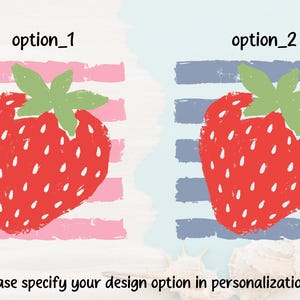 May include: Two graphic design options featuring a red strawberry with green leaves. Option 1 has a pink striped background, and option 2 has a blue striped background. The text reads: option_1, option_2, and Please specify your design option in personalization box.