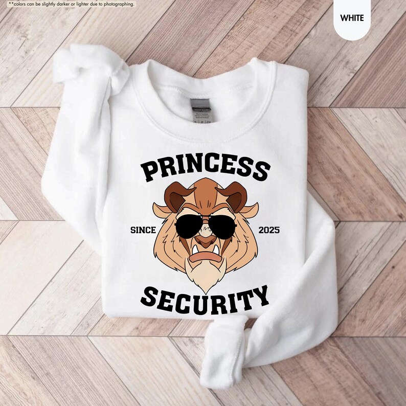 May include: White sweatshirt with a cartoon image of a beast wearing sunglasses and the text "PRINCESS SECURITY SINCE 2025".