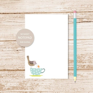 May include: A 50-sheet notepad with a cute illustration of a bird perched on a blue and white polka dot teacup. The notepad is 4x6 inches.