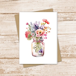 May include: A watercolor painting of a bouquet of flowers in a clear glass jar. The flowers are pink, purple, orange, and yellow. The jar has a pink ribbon tied around it.