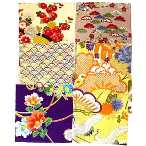 May include: A collection of six rectangular fabric swatches featuring diverse patterns including red and white chrysanthemums, geometric wave motifs, orange floral designs, purple backgrounds with colorful flowers, and white cranes on yellow.