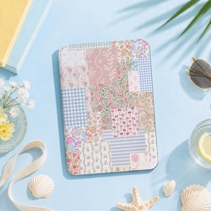 May include: A rectangular e-reader case featuring a patchwork design of various floral, gingham, and striped patterns in shades of pink, blue, green, and white. The surface displays a collage of botanical prints, small flower clusters, and geometric checks.