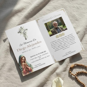 May include: A memorial card, open, with text and images. The left side features a cross with flowers, a portrait of the Virgin Mary, and the text "En Memoria De Diego Alejandro." The right side has a photo of a man and text.