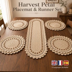 May include: A beige crochet table set featuring one long oval runner and four round placemats. Each piece has a textured center, a border of small brown bobble accents, and a scalloped edge. The text Harvest Petal Placemat & Runner Set is visible.
