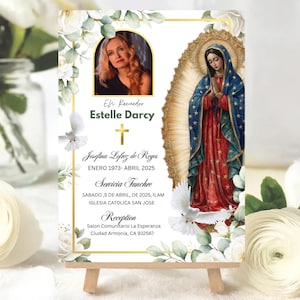 May include: A memorial card on a wooden easel, featuring a photo of a woman, Estelle Darcy, and an illustration of the Virgin Mary. The card includes text in Spanish, floral accents, and doves.