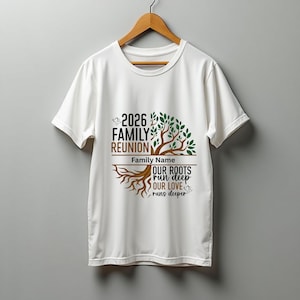 May include: White t-shirt with a family reunion design. The design includes the text "2026 Family Reunion" above a tree graphic with the words "Our Roots Run Deep, Our Love Runs Deeper". The shirt is hanging on a wooden hanger.