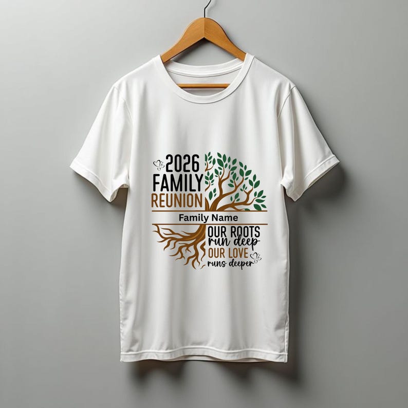 May include: White t-shirt with a family reunion design. The design includes the text "2026 Family Reunion" above a tree graphic with the words "Our Roots Run Deep, Our Love Runs Deeper". The shirt is hanging on a wooden hanger.