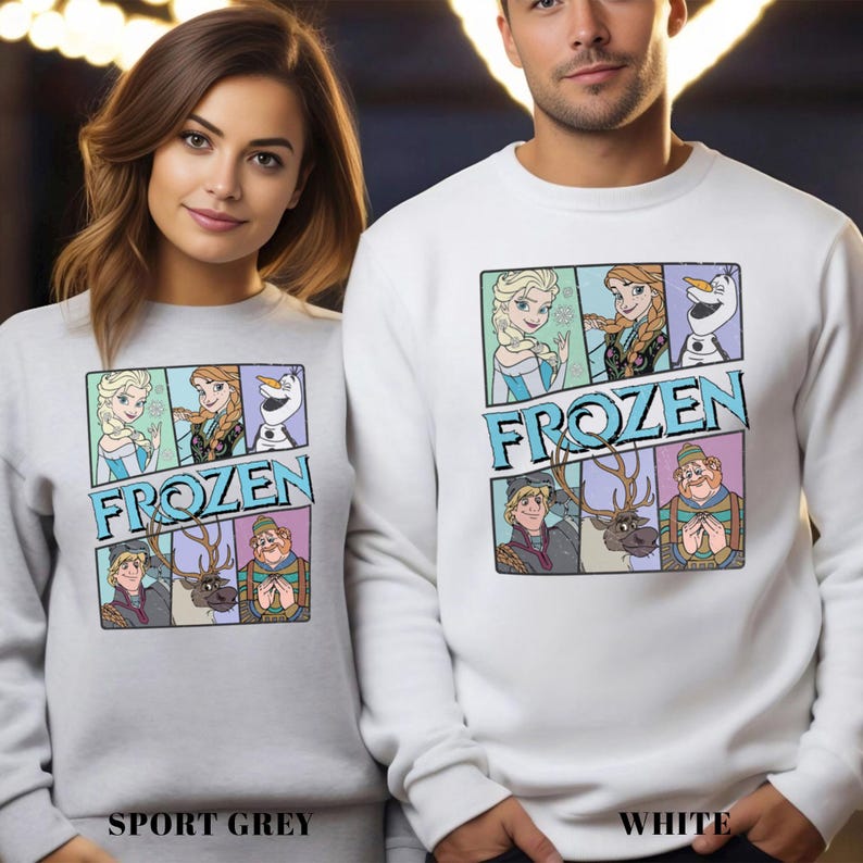 May include: Sport grey and white sweatshirts featuring a colorful graphic from the movie Frozen. The graphic includes images of Elsa, Anna, Olaf, Kristoff, Sven, and Hans. The word "FROZEN" is printed in blue block letters.