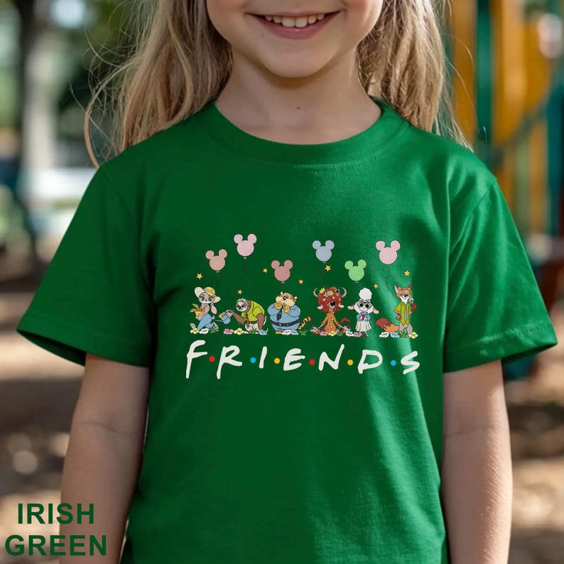 May include: Green t-shirt with the word "FRIENDS" in white, featuring cartoon characters and Mickey Mouse silhouettes. The shirt is labeled "IRISH GREEN" at the bottom.