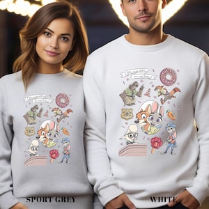 以下が含まれることがあります： キャラクター、ドーナツ、テキストが描かれた、カラフルな漫画デザインのスポーツグレーと白のスウェットシャツ。スウェットシャツは長袖とクルーネックです。スウェットシャツのテキストは「You can be whatever you want to be.」と書かれています。