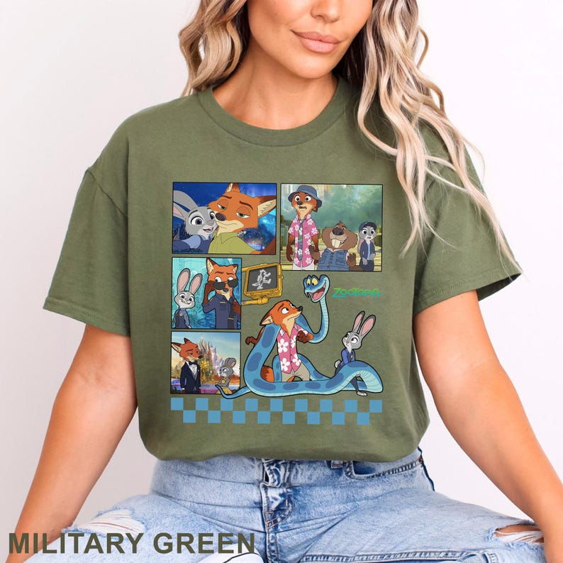 Pu&ograve; includere: T-shirt verde militare con una grafica colorata dei personaggi del film d'animazione Zootropolis. Il design include pi&ugrave; pannelli con immagini della volpe, del coniglio e di altri personaggi. La parola "Zootropolis" &egrave; stampata anche sulla maglietta.
