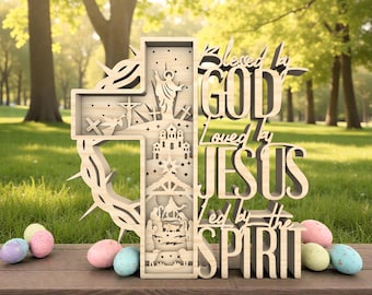 May include: A wooden cross with intricate cutouts depicting religious scenes and the text "Blessed by GOD, Loved by JESUS, Led by the SPIRIT." Colorful Easter eggs rest on a wooden surface in front of the cross.