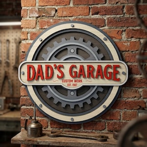 May include: Round wooden sign with the text "DAD'S GARAGE" in red, over a gear design. The sign is mounted on a brick wall. The sign also includes the text "CUSTOM WORK EST. 1987".