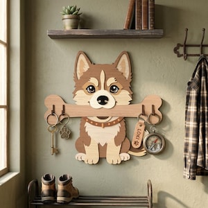May include: Wooden key holder shaped like a cartoon dog, holding a bone with key hooks. The dog is brown and cream-colored, with a collar. A key, paw print charm, and a compass are hanging from the hooks. The name "LOKI" is on a tag.