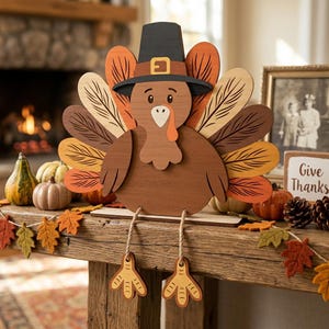 May include: A wooden turkey decoration featuring a brown body, a black pilgrim hat with a yellow buckle, and a fan of colorful feathers in shades of orange, brown, and cream. The turkey has dangling rope legs with yellow feet and sits on a base.