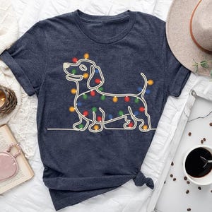 Christmas Dachshund Shirt – Festive Wiener Dog Outline with Holiday Lights Tee – Sausage Dog Lover Gift – Funny Pet Owner Christmas T-Shirt