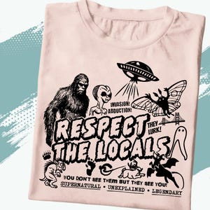 Respect The Locals Cryptid Shirt – Funny Bigfoot Mothman Alien Tee – Paranormal Supernatural Cryptozoology Shirt – UFO Abduction T-shirt
